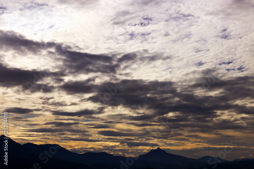 Sonnenuntergang mit Gewitterwolken über den Allgäuer Alpen photo