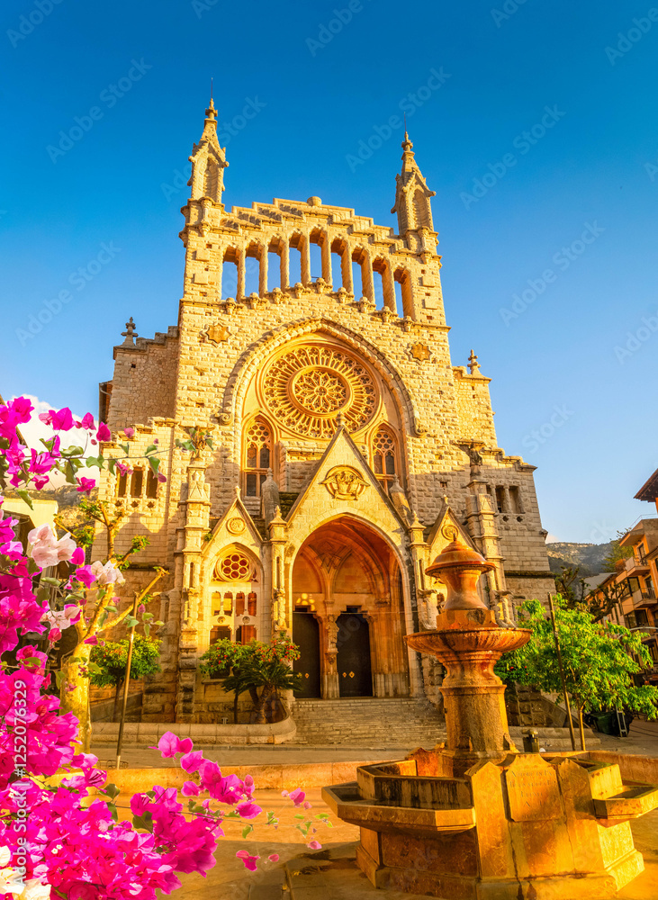 Obraz premium cathedral church in old town of Soller, Spain with flowers