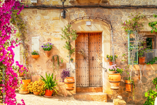 wall with traditional flower pots in old town of Valdemossa, Majorca, Spain