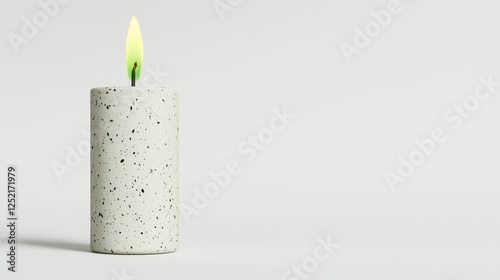 Lit speckled candle on white background; peaceful scene