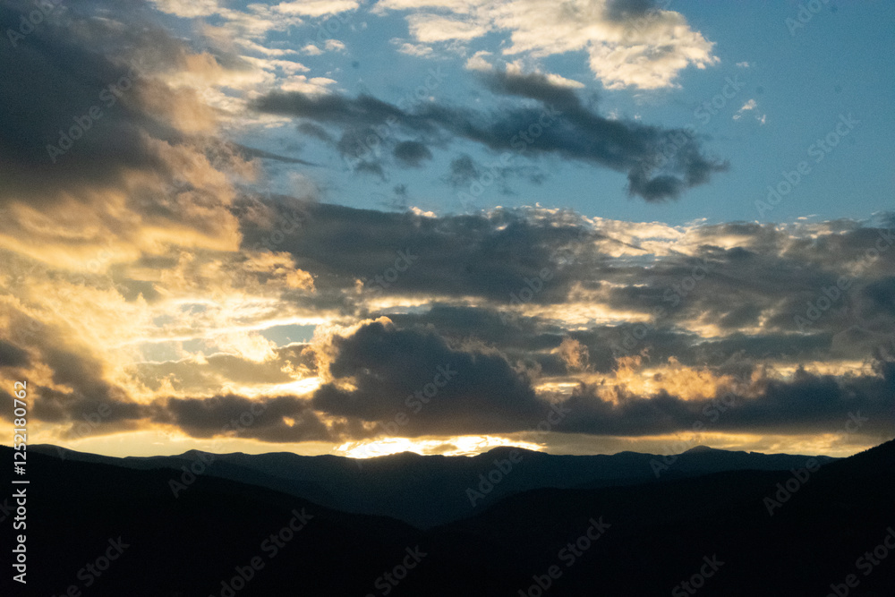 Glowing Clouds at Sunset Over Rocky Mountains Glowing Clouds at Sunset Over Rocky Mountains