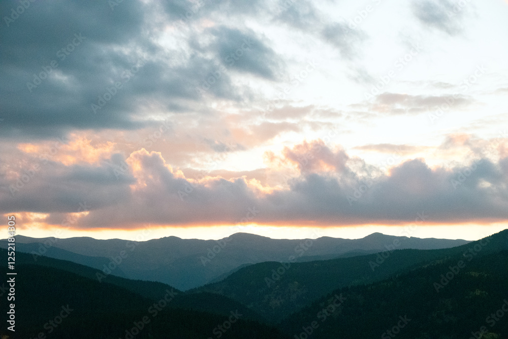 Glowing Clouds at Sunset Over Rocky Mountains Glowing Clouds at Sunset Over Rocky Mountains