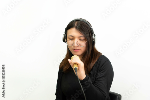 Woman (LGBTQ) singer sing a song with microphone photo