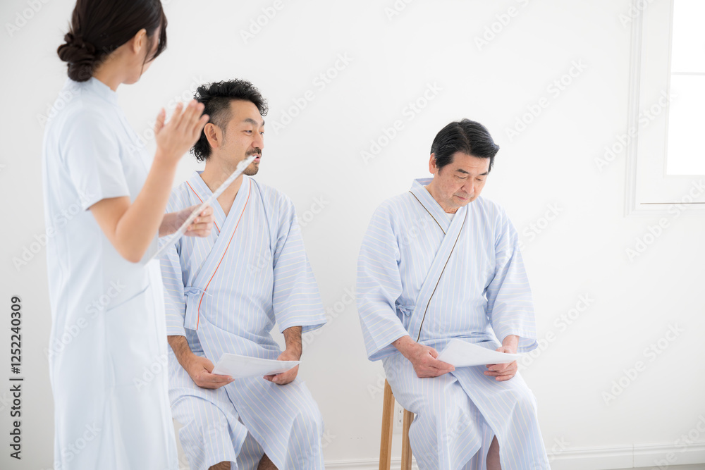 Fototapeta premium 会社などの集団検診 看護師に案内や説明されるイメージ