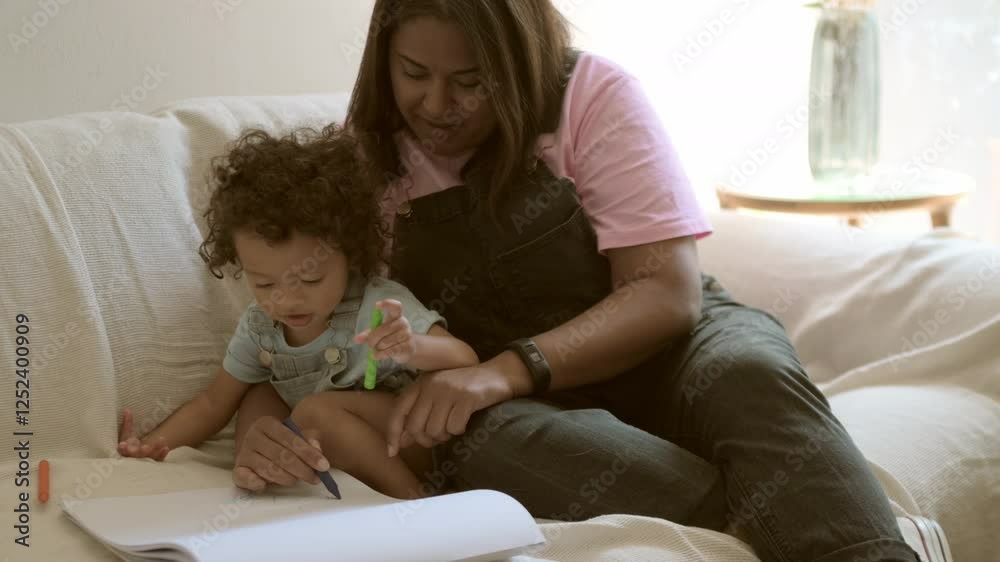 Home, baby and mother with love, writing and education for growth, learning and creative fun on sofa. Mama, parent and infant with mom on couch with book for child development, teaching and relax Home, baby and mother with love, writing and education for growth, learning and creative fun on sofa. Mama, parent and infant with mom on couch with book for child development, teaching and relax