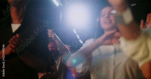 Congregants applauding in spiritual unity, mixed group of people celebrating faith during evangelical church service, hands clapping, expressions of worship and devotion