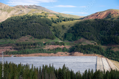 Tailing pond with mountains in the background