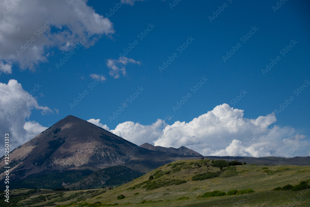 Fototapeta premium Clouds and blue skies over mountains in Southern Colorado