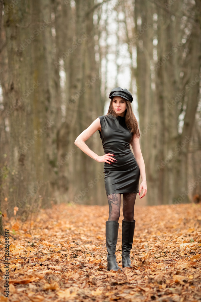 Portrait of a young beautiful brown-eyed long-haired girl in a black dress in nature. Portrait of a young beautiful brown-eyed long-haired girl in a black dress in nature.