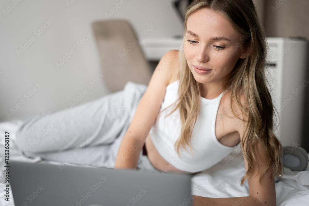 girl student relaxing in bedroom at home watching movie or using social media on bed using laptop computer girl student relaxing in bedroom at home watching movie or using social media on bed using laptop computer