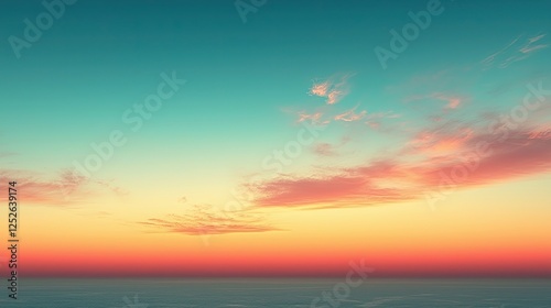 Vibrant sunset over the calm ocean with colorful clouds and a gradient sky in a serene beachfront location photo