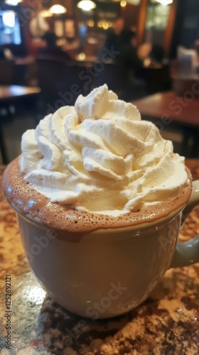 Delightful whipped cream topped beverage in a cozy cafe setting during the af...