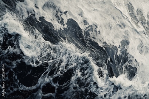 Surging wave curled over with dramatic texture in black and white photography