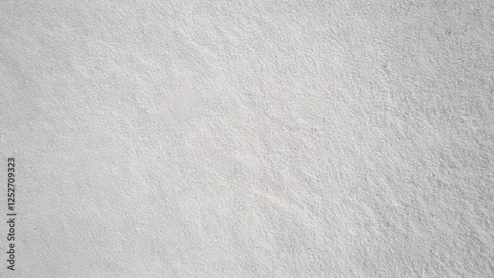 Obraz premium Close-up of white beach sand texture background