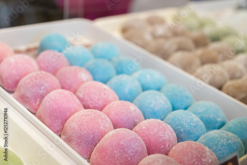 Close-up view of the colouful mochi selling at the bakery shop.