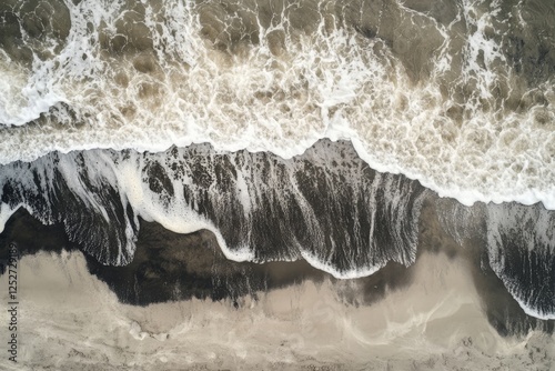 Waves washing ashore at a serene beach during the early morning hours