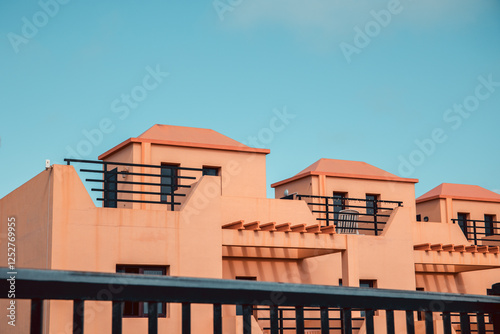 Tyipical canarian homes in Fuerteventura, Canary Islands, Spain. Beige colored little houses, terraced houses or town houses from the Eighties. Retro style vintage look.