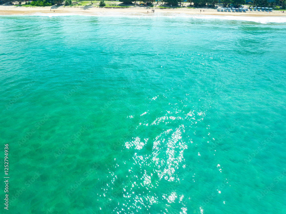 Aerial view of blue sea surface water texture background,Sun reflections on water, Aerial flying drone view Waves water surface texture on sunny tropical ocean in Phuket island Thailand Aerial view of blue sea surface water texture background,Sun reflections on water, Aerial flying drone view Waves water surface texture on sunny tropical ocean in Phuket island Thailand