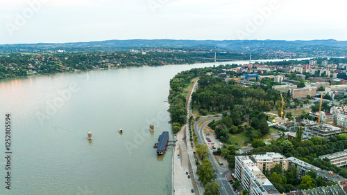 Aerial view of Danube river in Novi Sad Serbia with riverside road and greenery