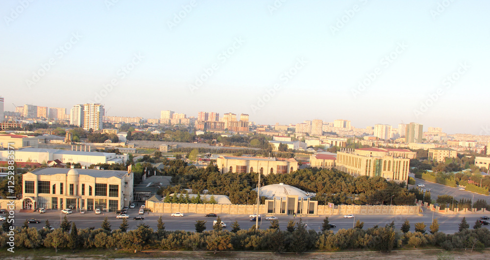 Baku, Azerbaijan. Buildings look faded due to smog and air pollution over the city. The air in the city center is polluted by restaurants, factories and cars Baku, Azerbaijan. Buildings look faded due to smog and air pollution over the city. The air in the city center is polluted by restaurants, factories and cars