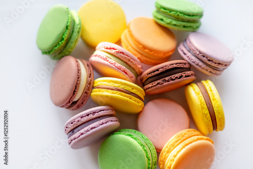 Slika na platnu A colorful assortment of macarons in various pastel shades, beautifully arranged
