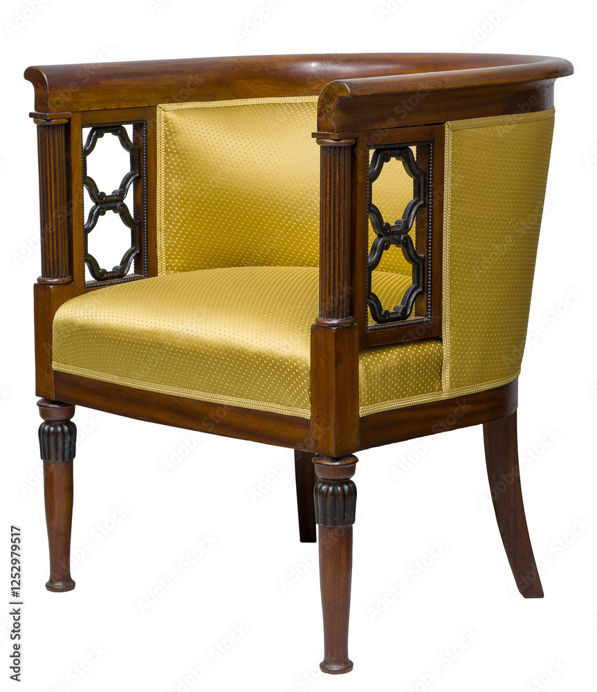 Elegant, classic armchair with a barrel back, isolated on a white background. Wooden frame with decorative details and golden yellow upholstery.