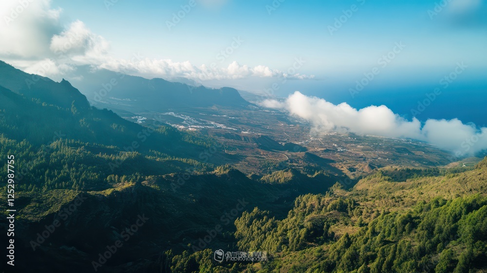Obraz premium Aerial View of a Lush Mountain Range and Ocean Coastline