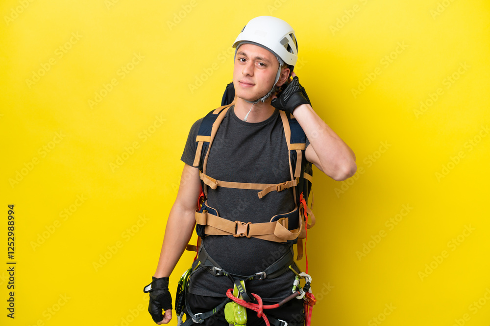 Fototapeta premium Young rock climber Brazilian man having doubts