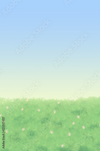 field of grass and blue sky