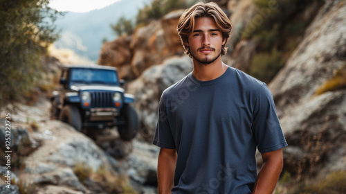 Dark Gray T-Shirt Mockup on Model with Updo Hairstyle Against Rugged Off-Road Trail photo