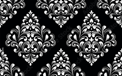 Wallpaper in the style of Baroque. White and black floral ornament. Seamless vector background. Graphic pattern for fabric, wallpaper, packaging. Ornate Damask flower illustration.