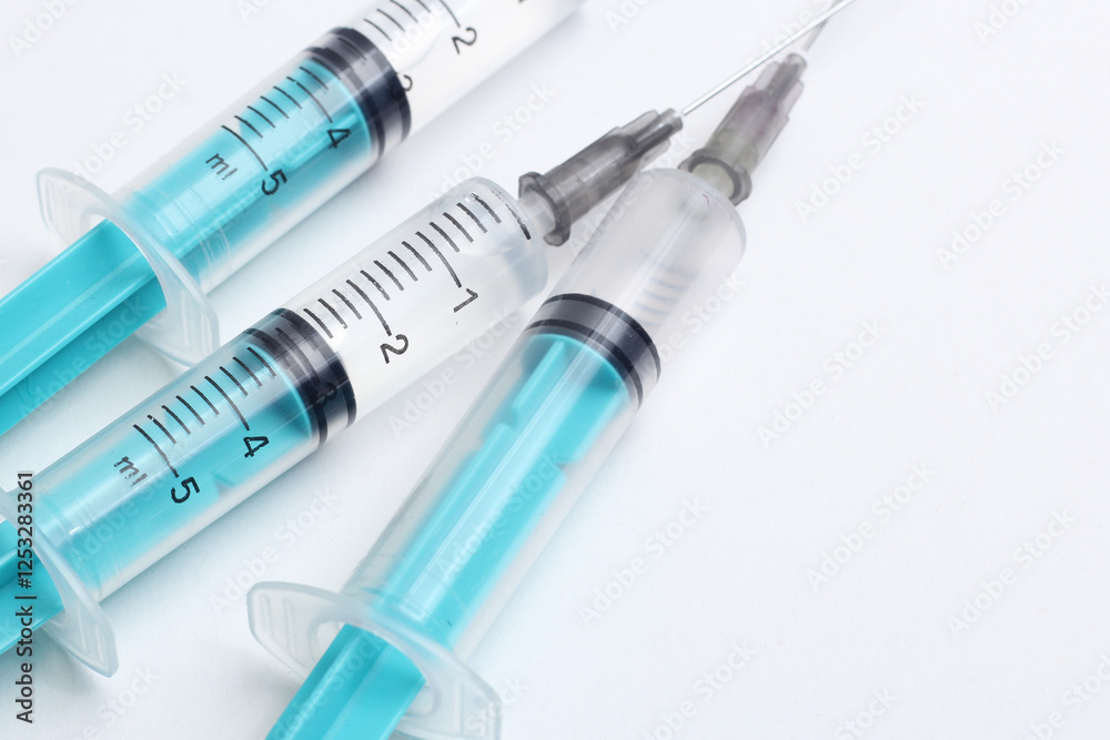 Disposable plastic syringe prepared for injection and vaccination in the hospital. The concept of medicine and health Disposable plastic syringe prepared for injection and vaccination in the hospital. The concept of medicine and health