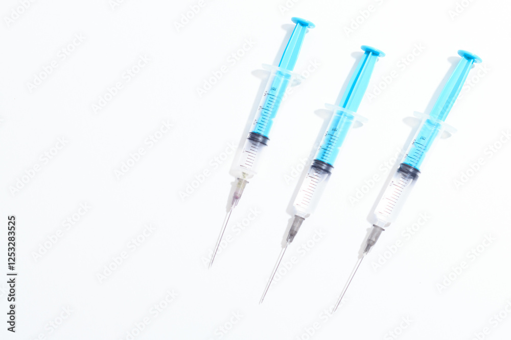 Disposable plastic syringe prepared for injection and vaccination in the hospital. The concept of medicine and health Disposable plastic syringe prepared for injection and vaccination in the hospital. The concept of medicine and health
