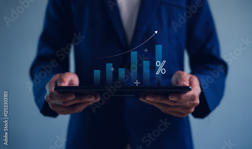 Wallpaper Mural Hand holding graph with percentage, returns on investments,tax, adjusting interest rates, raising interest rates to fight inflation. Torontodigital.ca