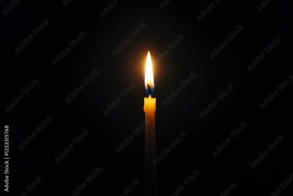 Single candle flame in dark background. Possible use Memorial, reflection, peace Single candle flame in dark background. Possible use Memorial, reflection, peace