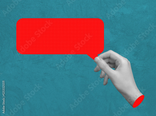 Hand holding a red speech bubble, symbolizing negative feedback, bad review, or toxic online comments. Concept of communication, opinion, and social media dialogue. photo