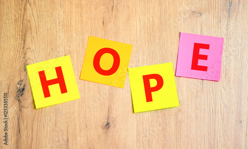Wallpaper Mural Hope symbol. Concept word Hope on beautiful colored paper. Beautiful wooden table wooden background. Business, lifestyle, support and hope concept. Copy space. Torontodigital.ca