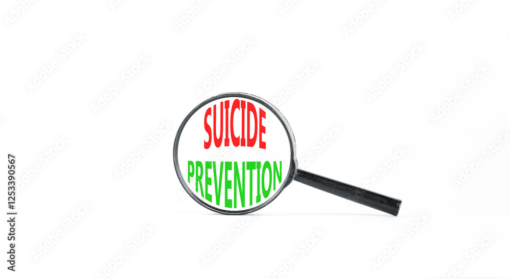 Suicide prevention symbol. Concept words Suicide prevention on beautiful magnifying glass. Beautiful white table white background. Psychological suicide prevention concept. Copy space. Suicide prevention symbol. Concept words Suicide prevention on beautiful magnifying glass. Beautiful white table white background. Psychological suicide prevention concept. Copy space.