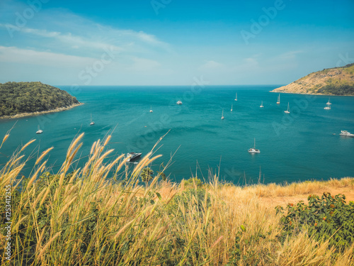 Satnding on the hill top see view at the windmill view point phuket Thailand