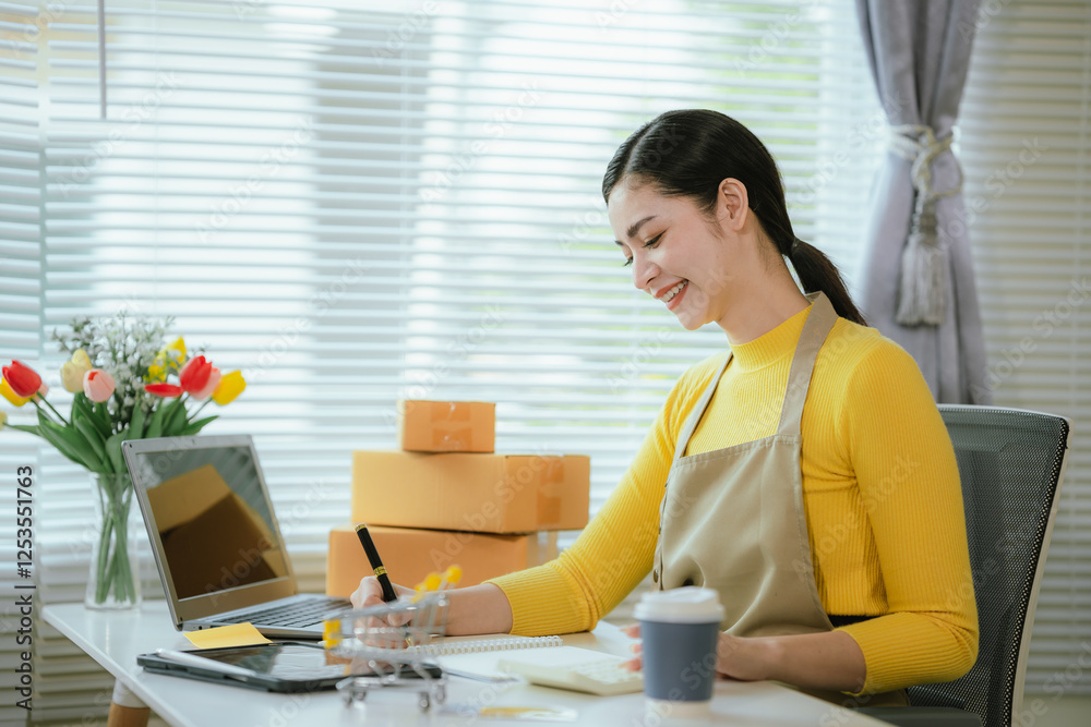 Portrait of Starting small businesses SME owners female entrepreneurs working on receipt box and check online orders to prepare to pack the boxes, sell Portrait of Starting small businesses SME owners female entrepreneurs working on receipt box and check online orders to prepare to pack the boxes, sell