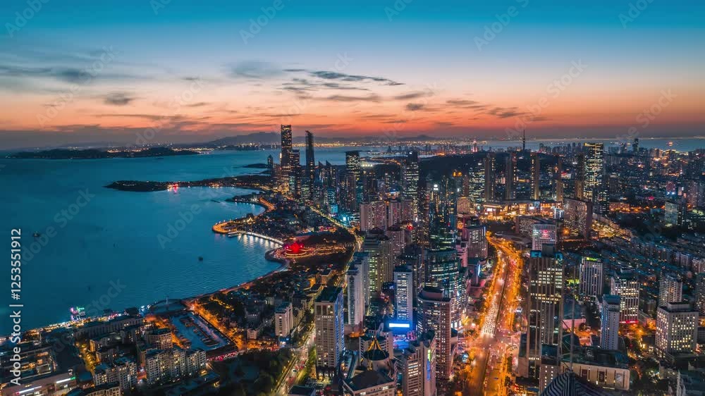 4k aerial video of stunning Qingdao skyline at dusk overlooking the coastline and modern architecture