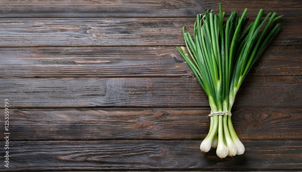 Bunch of fresh green onions on wooden table, top view. Space for text Bunch of fresh green onions on wooden table, top view. Space for text