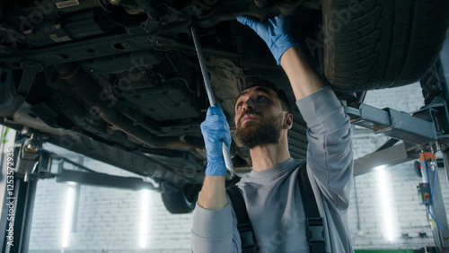 Photos Caucasian man guy technician repairman auto mechanic repair truck in car service