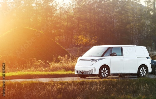 Compact van driving through countryside