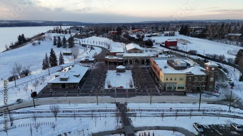 Winter fly over of Heritage Park historical village on a beautiful winter evening. 