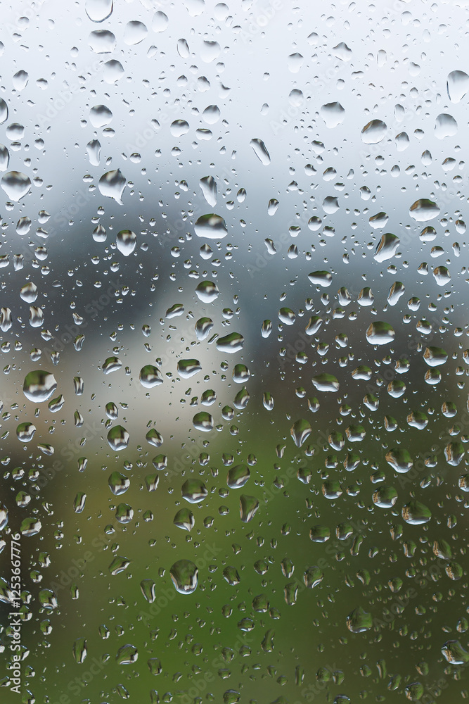 Raindrops on the glass in the window. Wet window after rain. Rain outside the window.