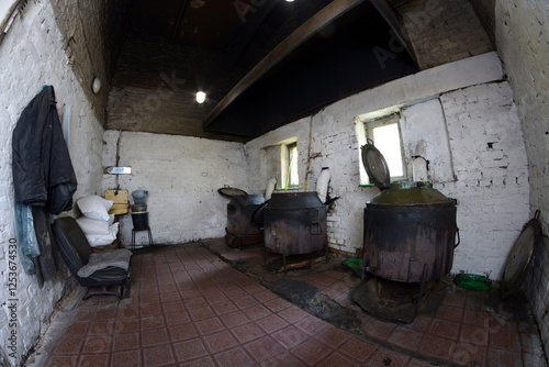 Municipal animal shelter kitchen, big tanks with broth for stray dogs prepared. Borodjanka, Ukraine photo