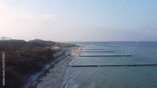 high drone shot of a coastline with calm water