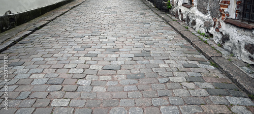 Abstract background. Old cobblestone pavement closeup