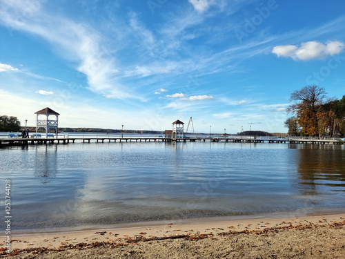 Beach in town Sława, Poland. Lake Sławskie. Plaża miejska i pomost w Sławie nad Jeziorem Sławskim. photo